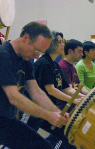 students learning taiko